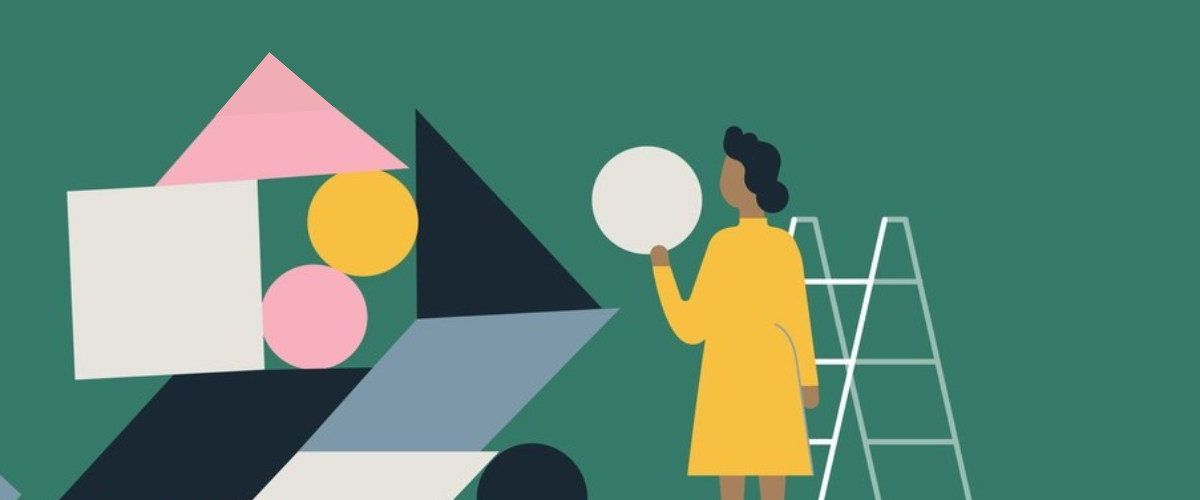 Woman stand on a ladder placing a circle on a precarious tower of shapes.